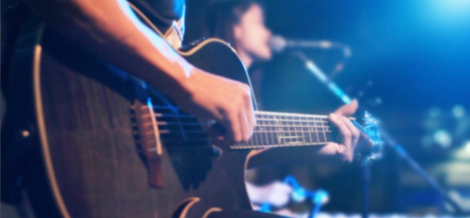 Guitarist playing complex rhythms with odd time signatures