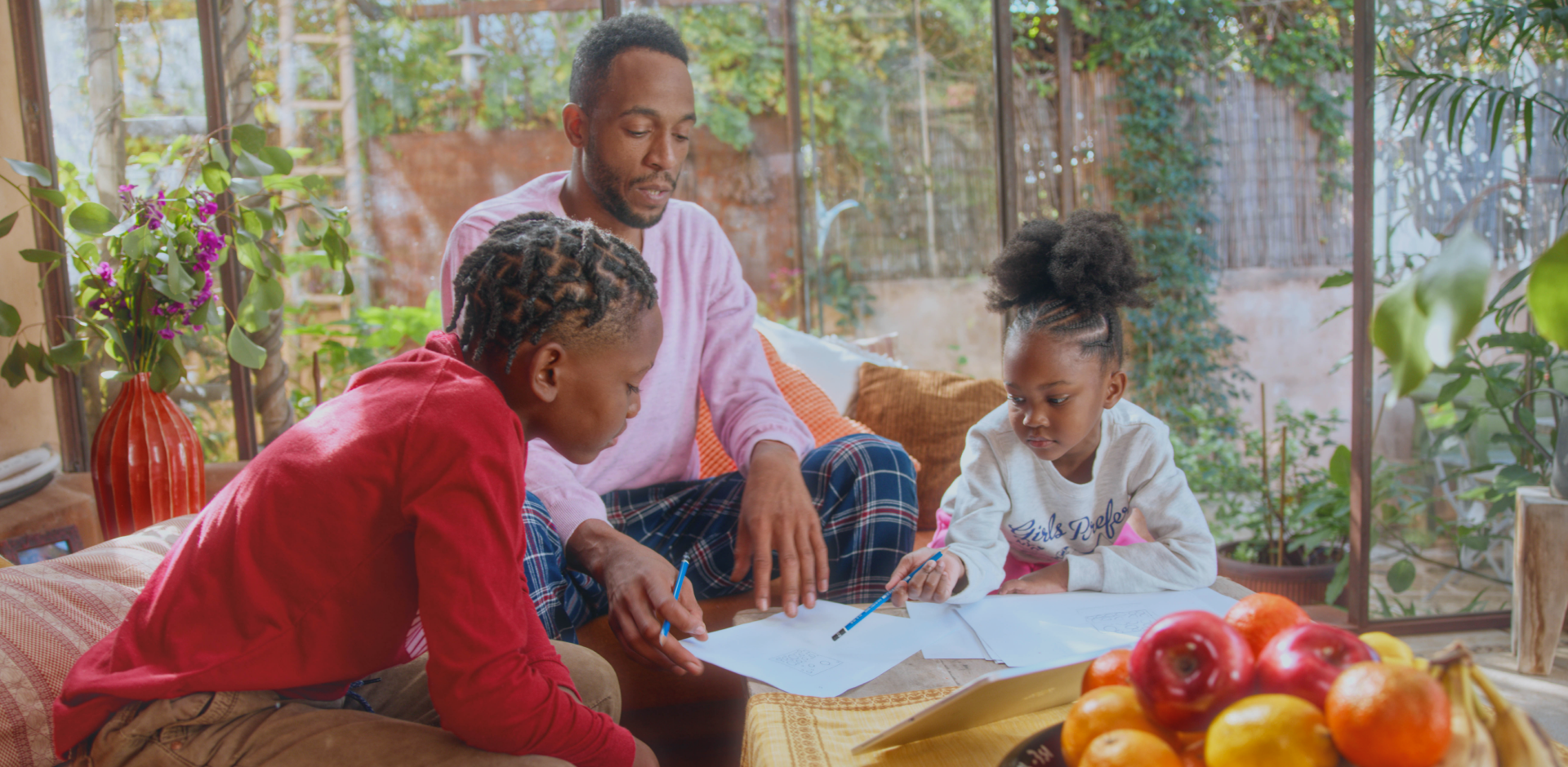 A family drawing together at a table