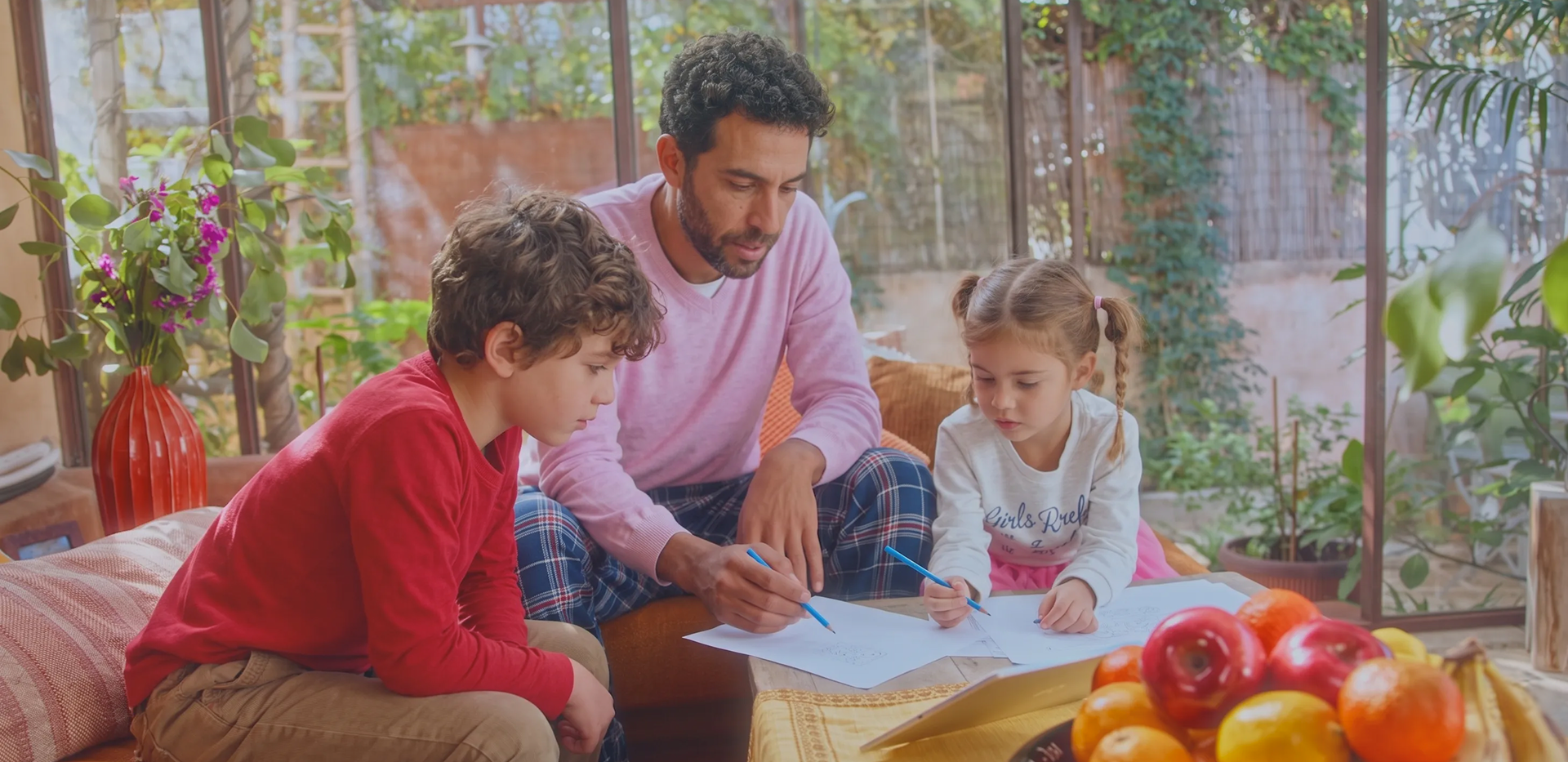 A family drawing together at a table
